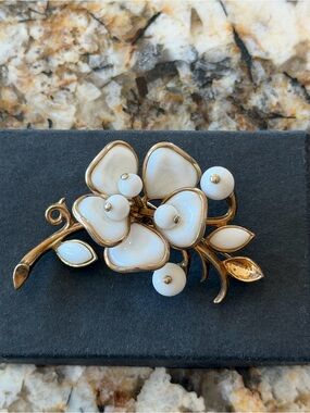 Trifari Gold Tone Brooch with White Enamel Blossoms